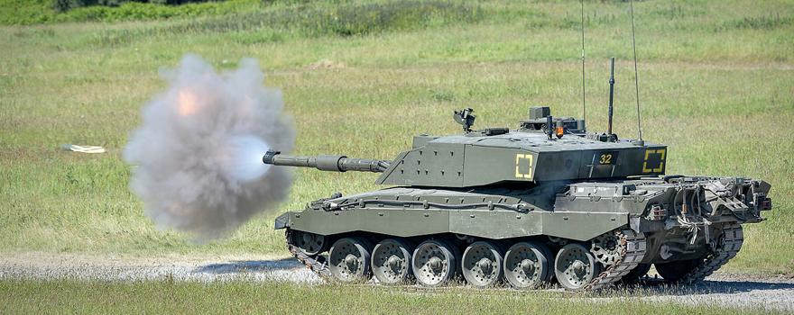 A Challenger 2 tank on Castlemartin Ranges in Pembrokeshire, Wales, fires a ‘Squash-Head’ practice round [UK MoD]